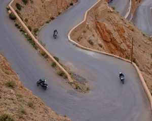 BMW motorcycle on the Dades Gorge hairpins near Tissadrine, Morocco
